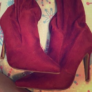 Thigh high pointy heeled boots